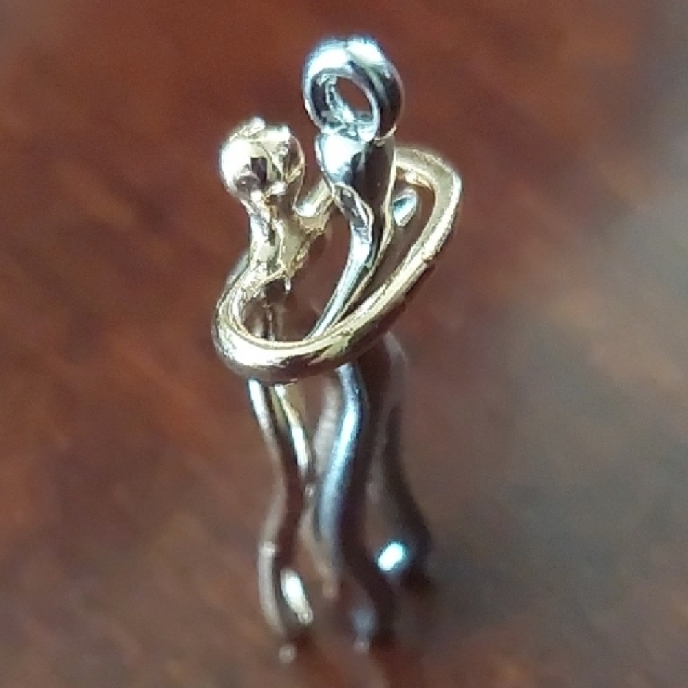 Elegant Gold and Silver Embrace Pendant
